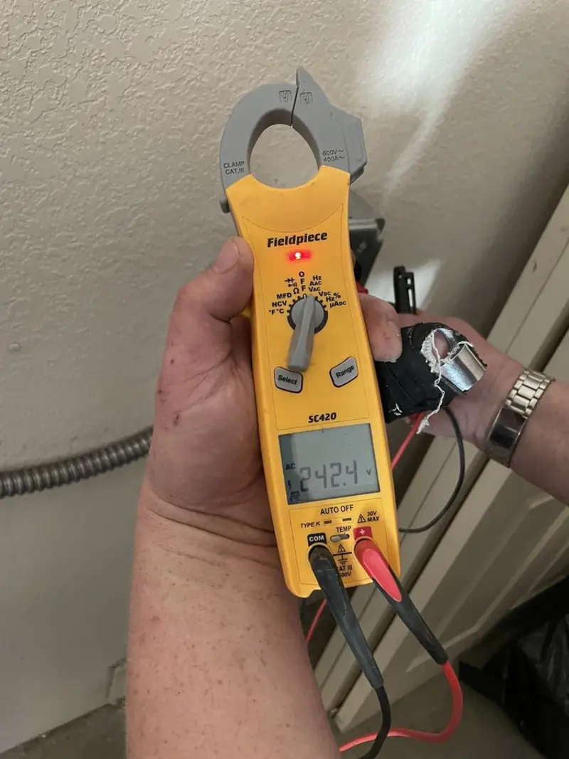 Voltage testing with clamp meter during Aluminum Wiring Replacement in Cannon